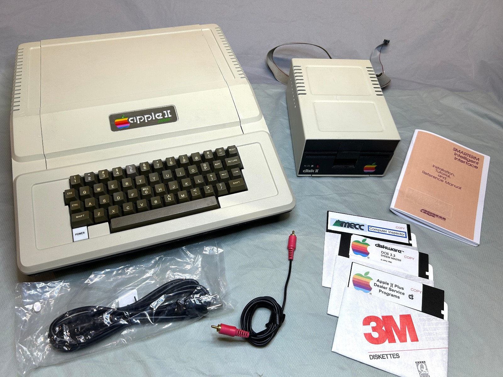 Apple II+ with 80-COL Card, Disk II, and Software.