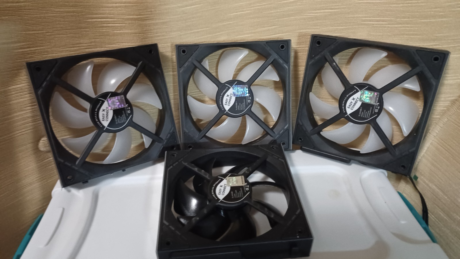 4 Thermaltake Case Fans,And CPU Cooler. also RGB controller