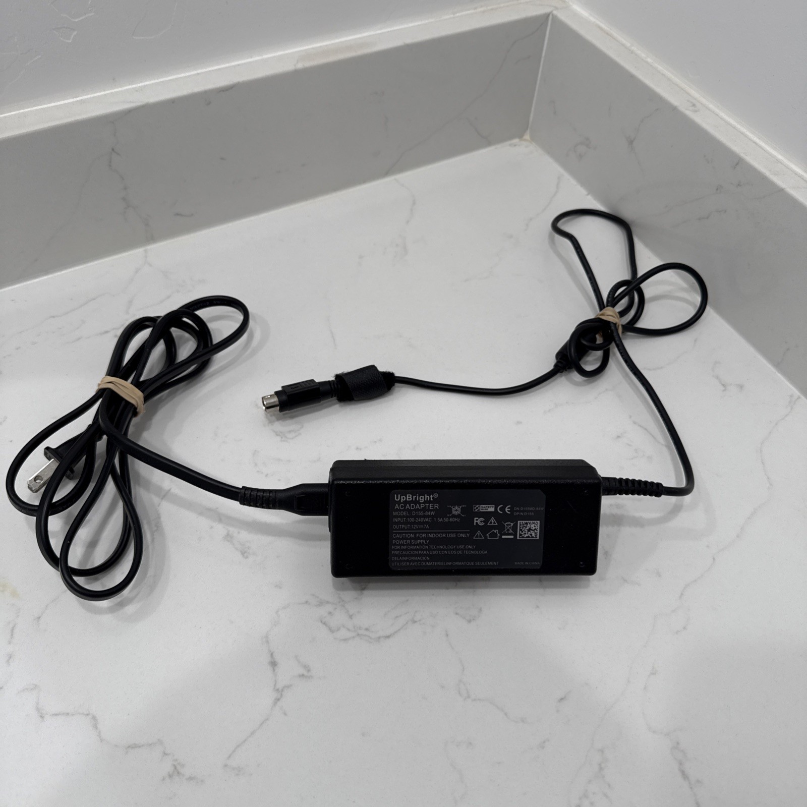 UpBright AC Adapter. 4-pin. Model D155-84W. Output is 12V-7A. Used but works