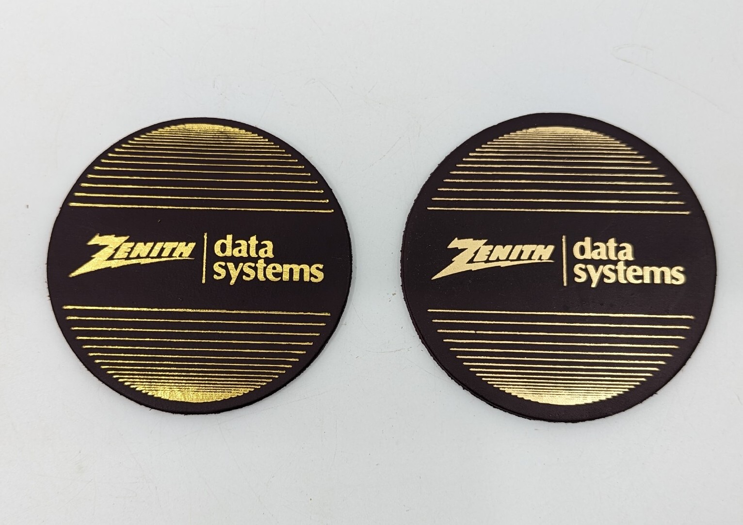 Set of Two Vintage Zenith Data Systems Leather Drink Coasters, Maroon & Gold