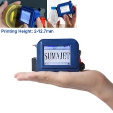 Mini handheld inkjet printer prints digital and letter logos on cardboard boxes picture