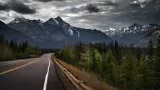 Landscape road mountains overcast pine trees snowy Custom Gaming Mat Desk picture