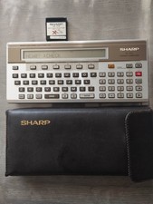 Sharp PC-1500 Pocket Computer with Case and RAM Module picture